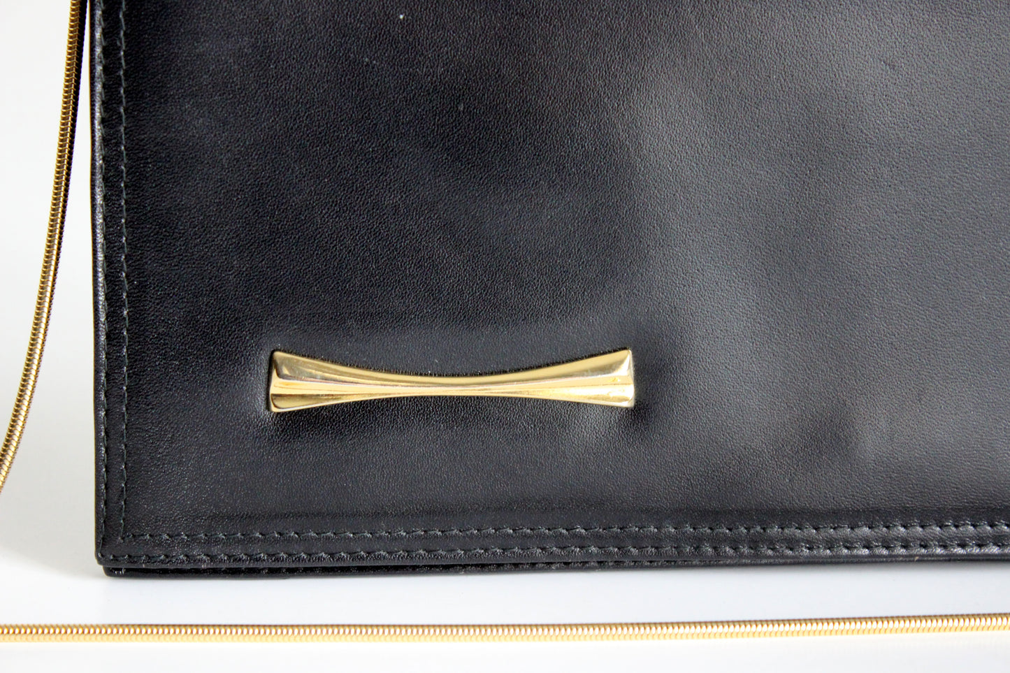 Eris – mid ’80s–early ’90s black calf-leather envelope clutch with gold-tone snake-chain strap
