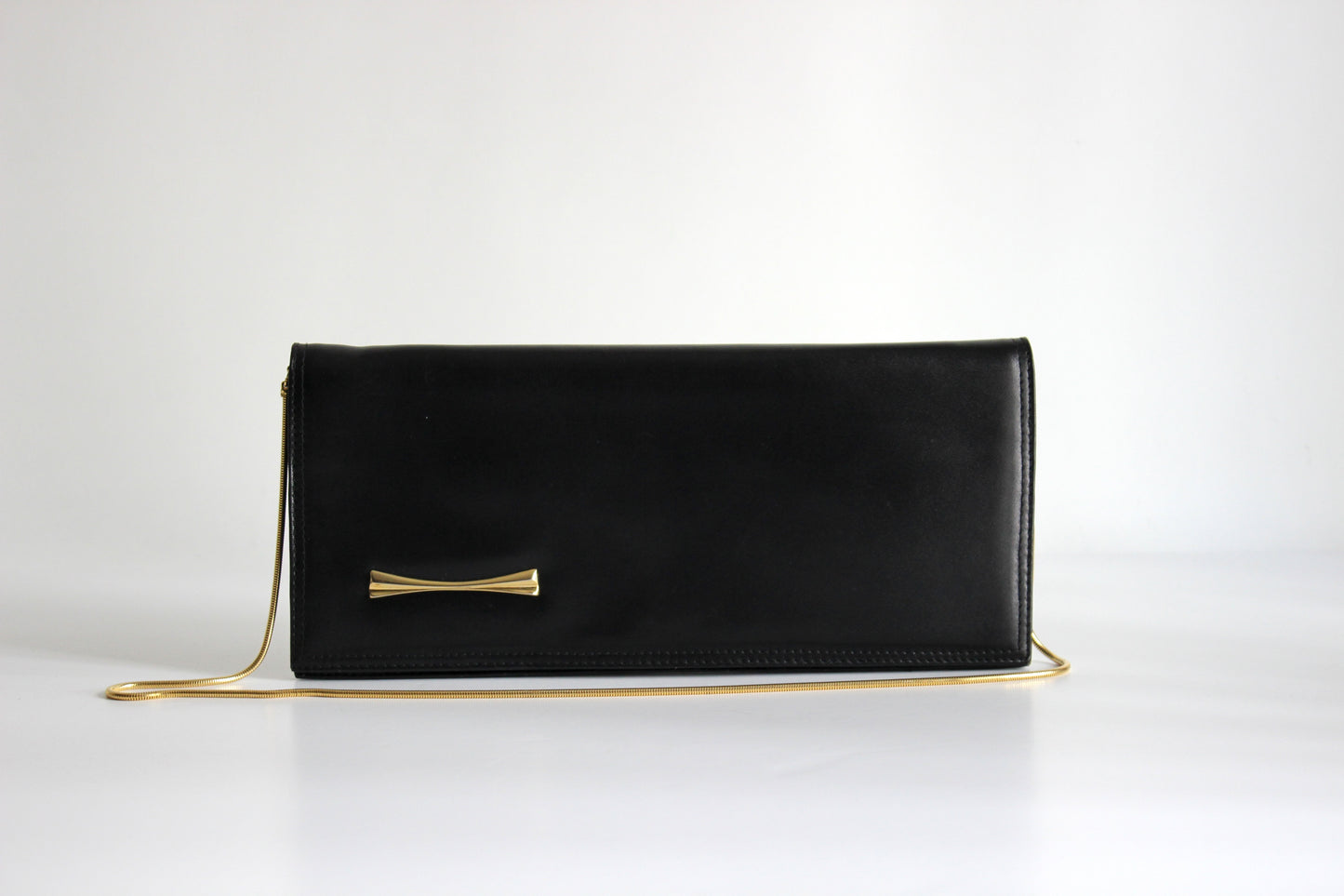 Eris – mid ’80s–early ’90s black calf-leather envelope clutch with gold-tone snake-chain strap