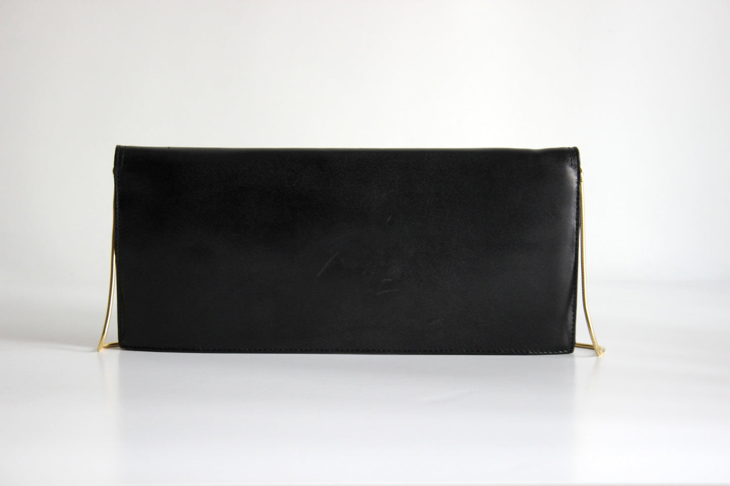 Eris – mid ’80s–early ’90s black calf-leather envelope clutch with gold-tone snake-chain strap