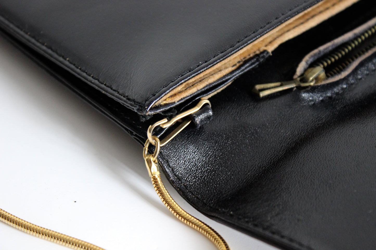 Eris – mid ’80s–early ’90s black calf-leather envelope clutch with gold-tone snake-chain strap