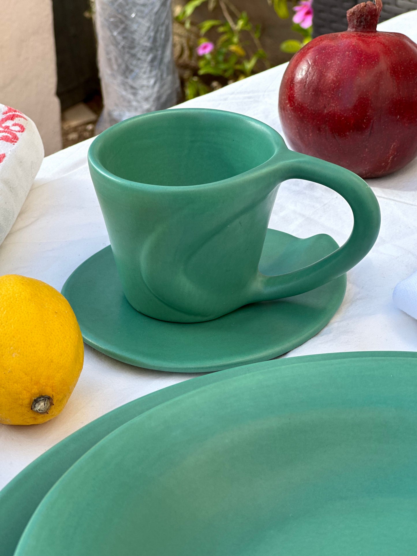 Julie Sanders “Cyclamen” dinnerware set – matte green ceramic, 20-piece, 1990s