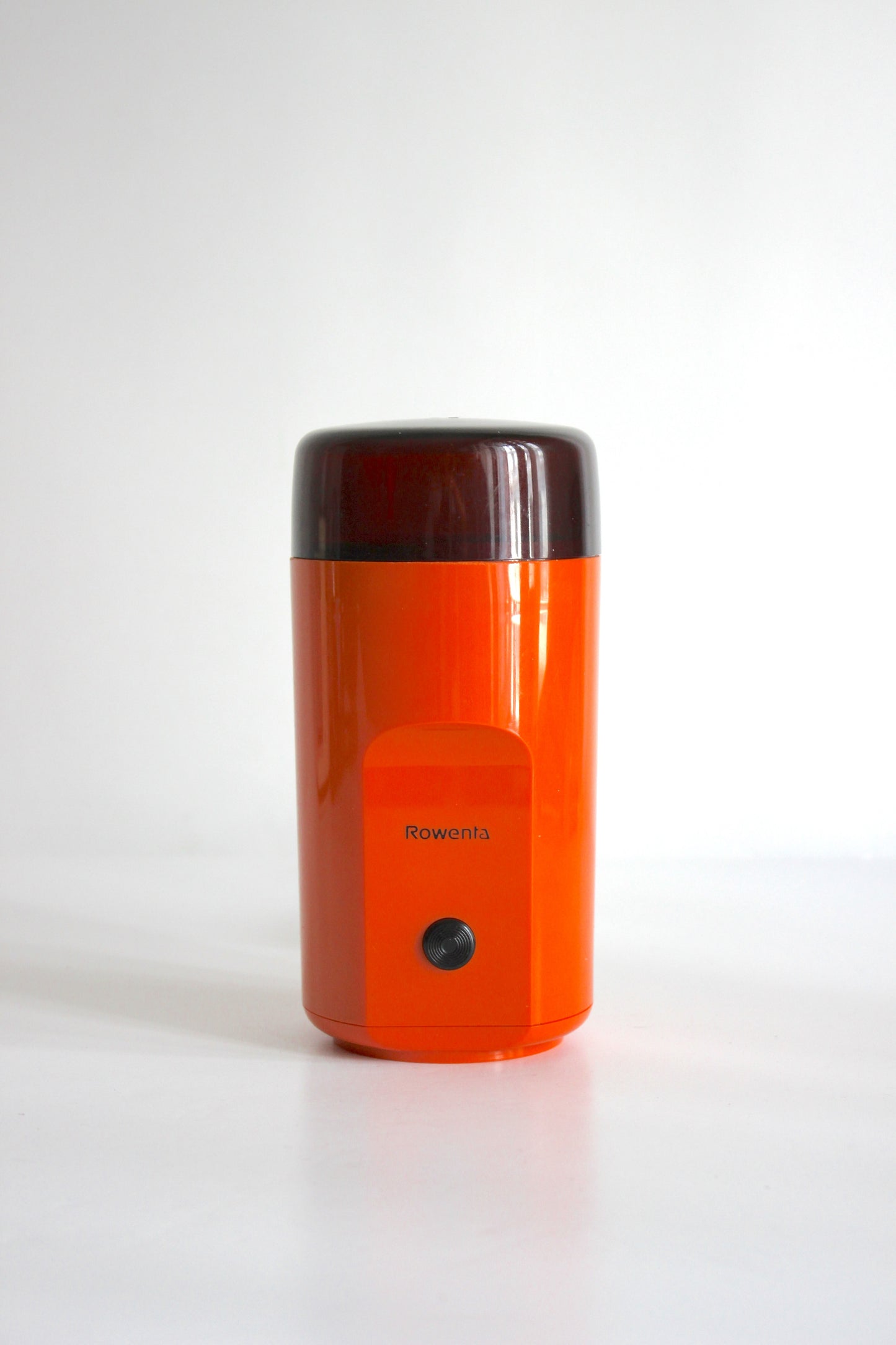 Vintage Rowenta electric coffee grinder · orange + smoked plastic · Germany, 1970s