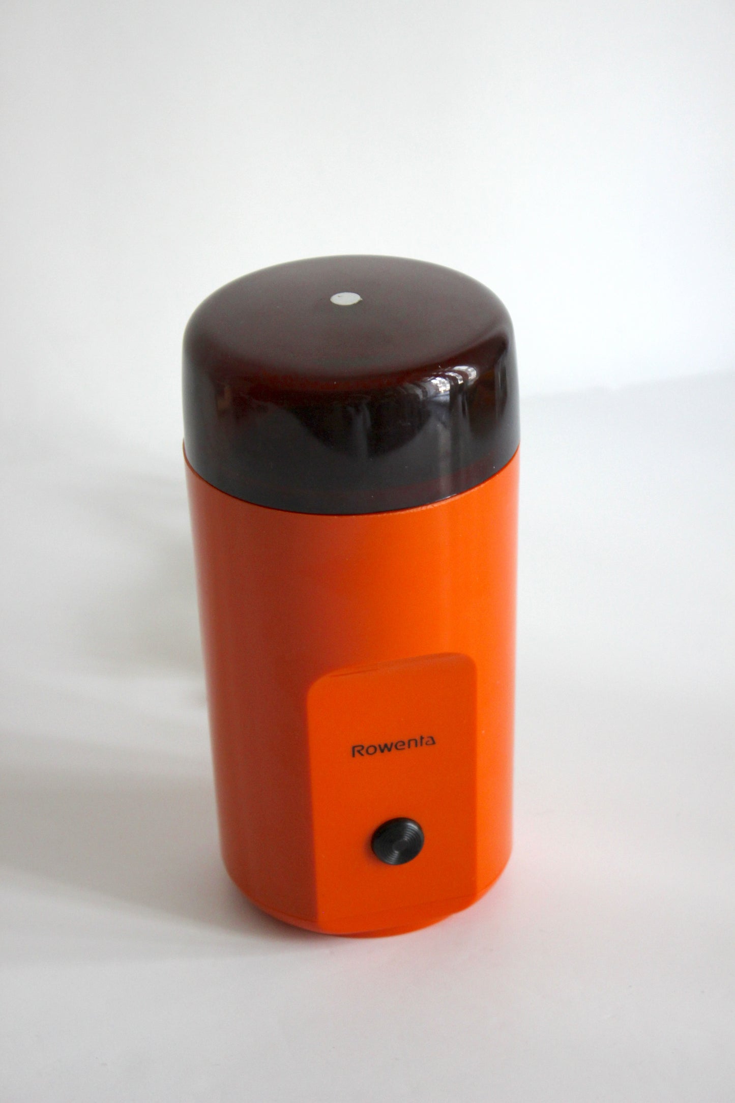 Vintage Rowenta electric coffee grinder · orange + smoked plastic · Germany, 1970s