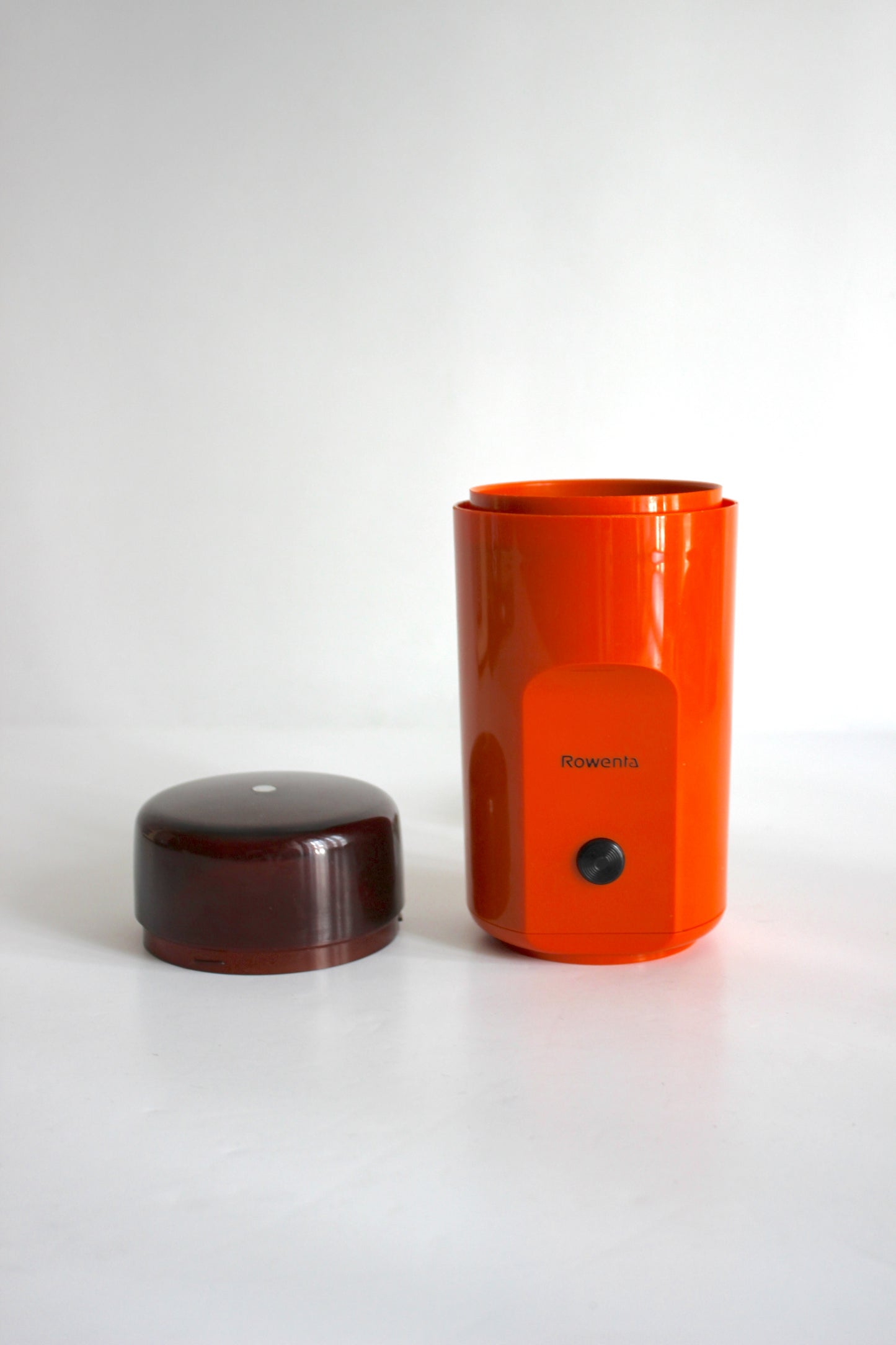Vintage Rowenta electric coffee grinder · orange + smoked plastic · Germany, 1970s