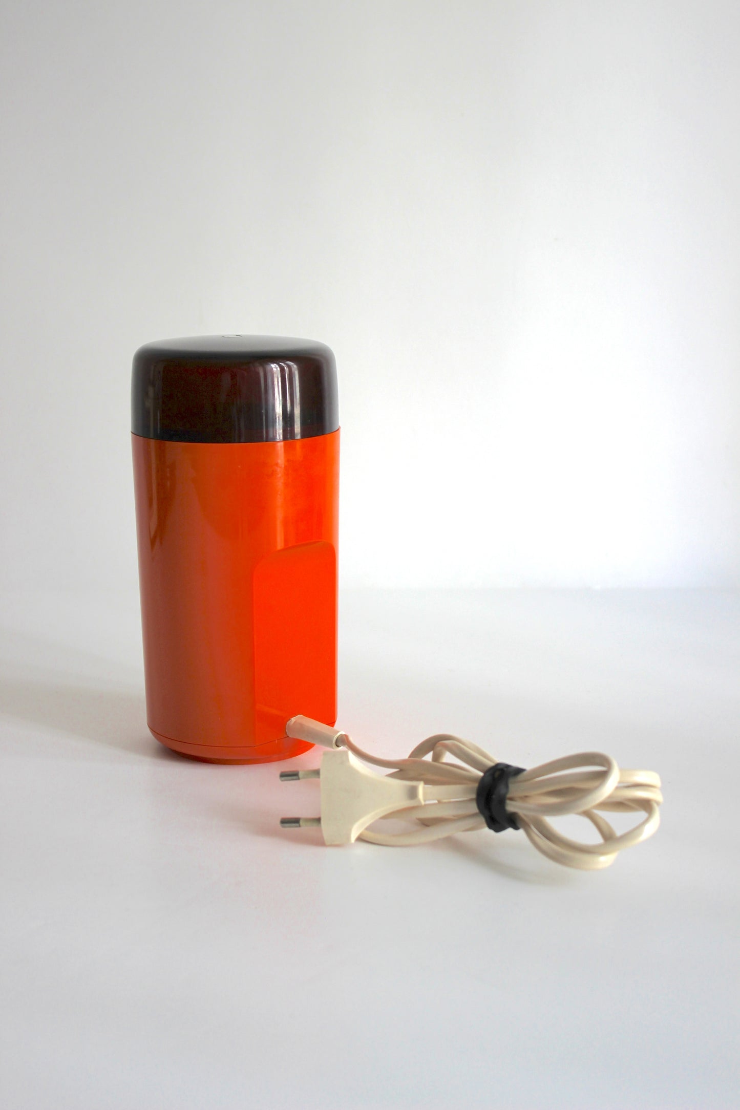 Vintage Rowenta electric coffee grinder · orange + smoked plastic · Germany, 1970s