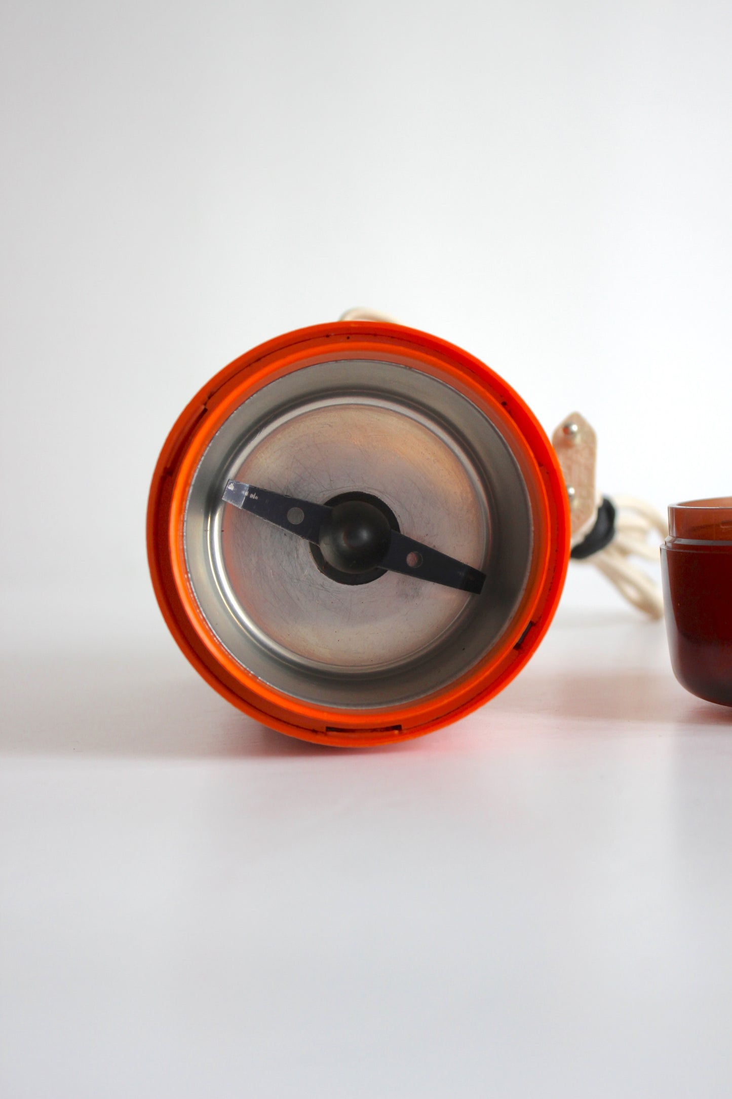 Vintage Rowenta electric coffee grinder · orange + smoked plastic · Germany, 1970s