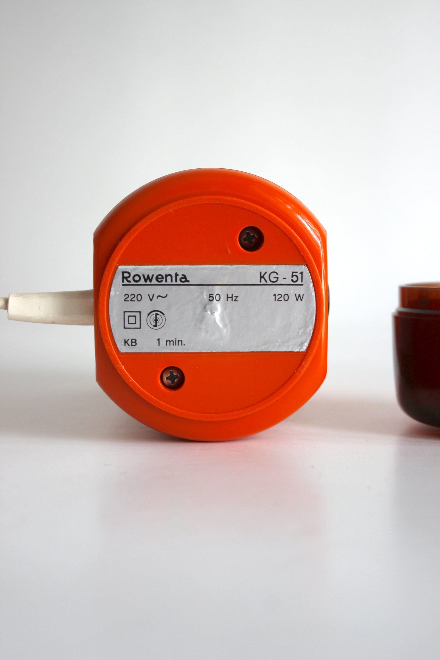 Vintage Rowenta electric coffee grinder · orange + smoked plastic · Germany, 1970s