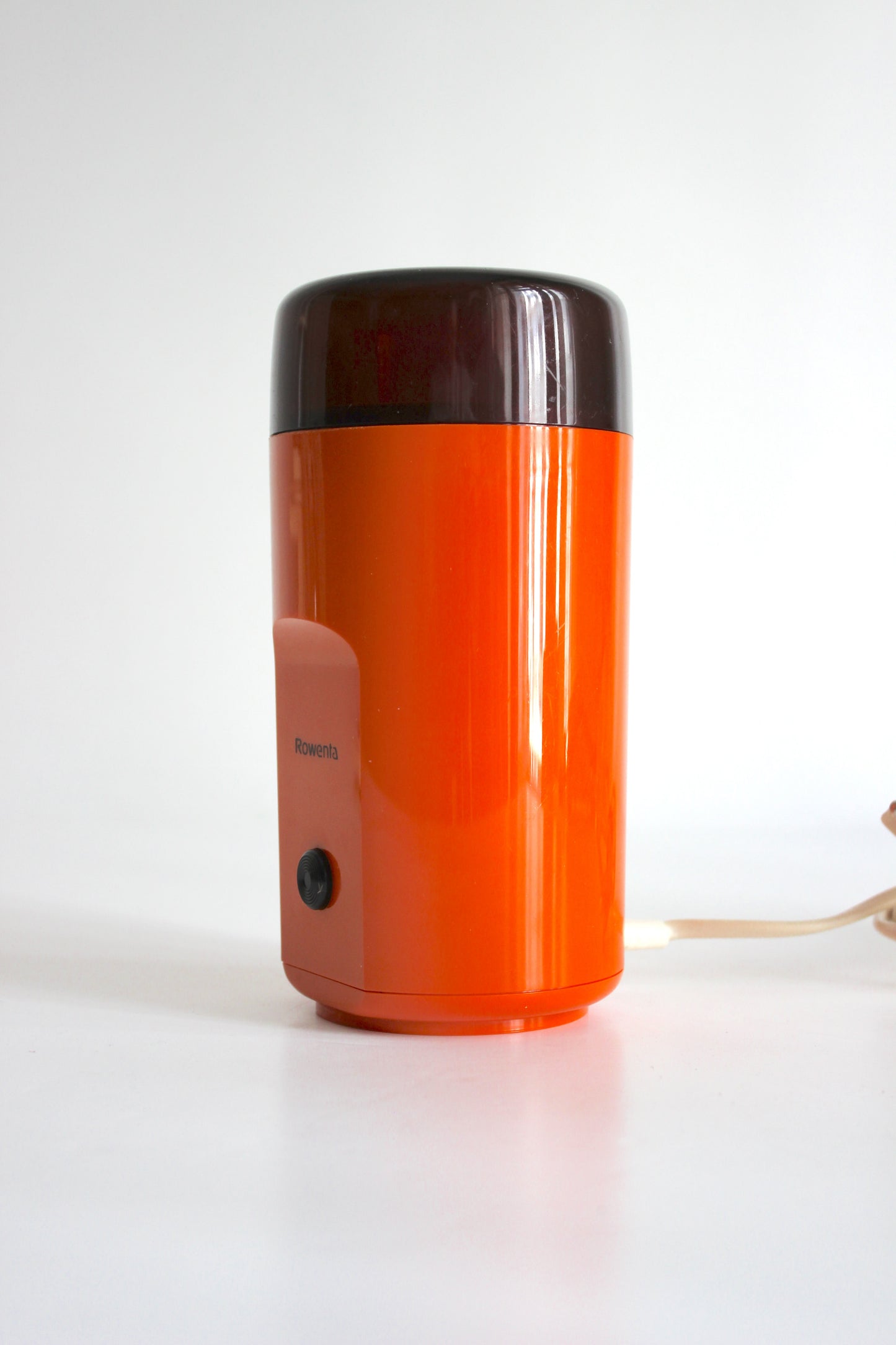 Vintage Rowenta electric coffee grinder · orange + smoked plastic · Germany, 1970s