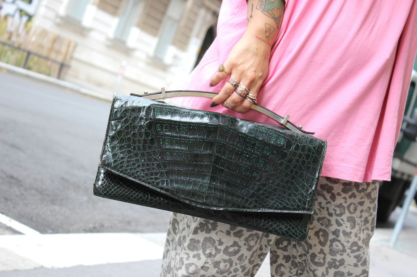 Persephone – early ’70s green-black crocodile-embossed leather clutch with silver-arc handle