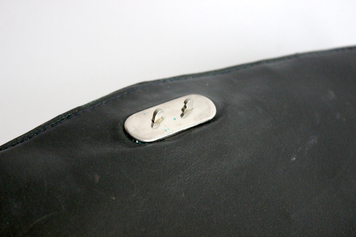 Persephone – early ’70s green-black crocodile-embossed leather clutch with silver-arc handle