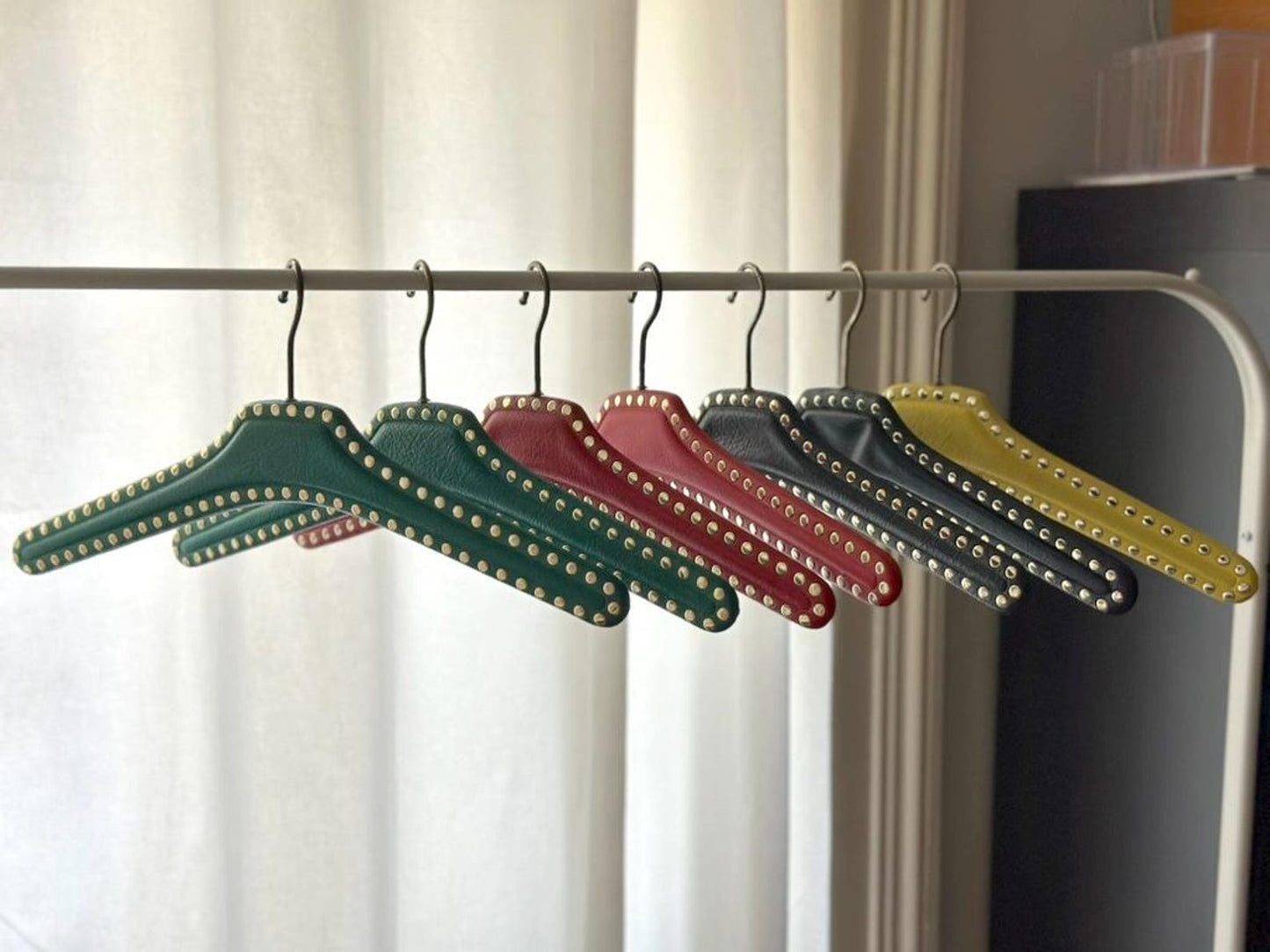 Set of 7 vintage skai hangers with studs. Mid-century. Germany, 1960s