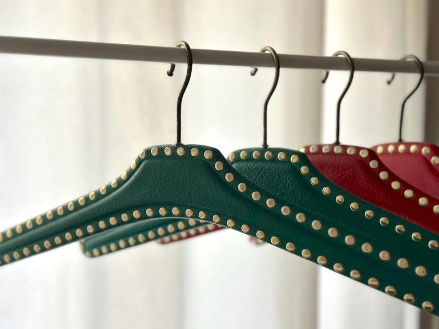 Set of 7 vintage skai hangers with studs. Mid-century. Germany, 1960s
