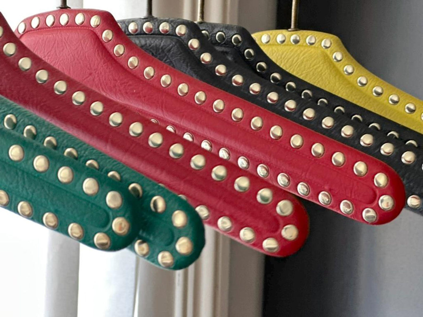 Set of 7 vintage skai hangers with studs. Mid-century. Germany, 1960s