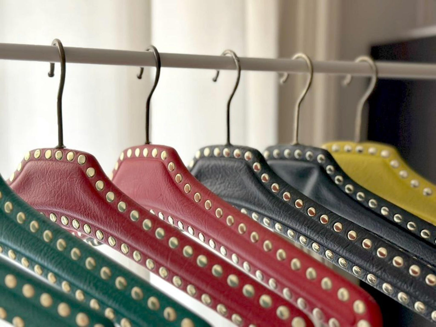 Set of 7 vintage skai hangers with studs. Mid-century. Germany, 1960s