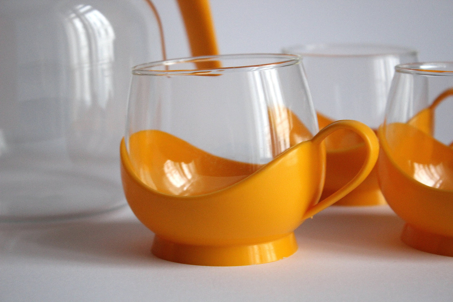 Melitta Germany Set of yellow glass tumblers and pitcher with plastic handles - 60s / 70s
