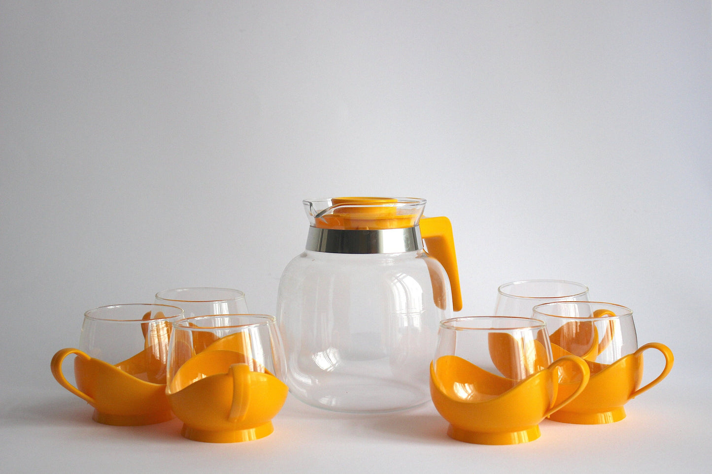 Melitta Germany Set of yellow glass tumblers and pitcher with plastic handles - 60s / 70s