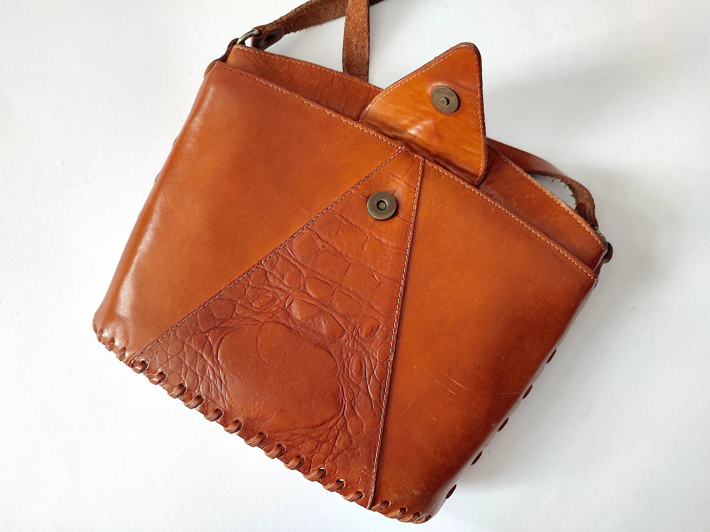 Vintage brown leather bag with a long handle. 90s