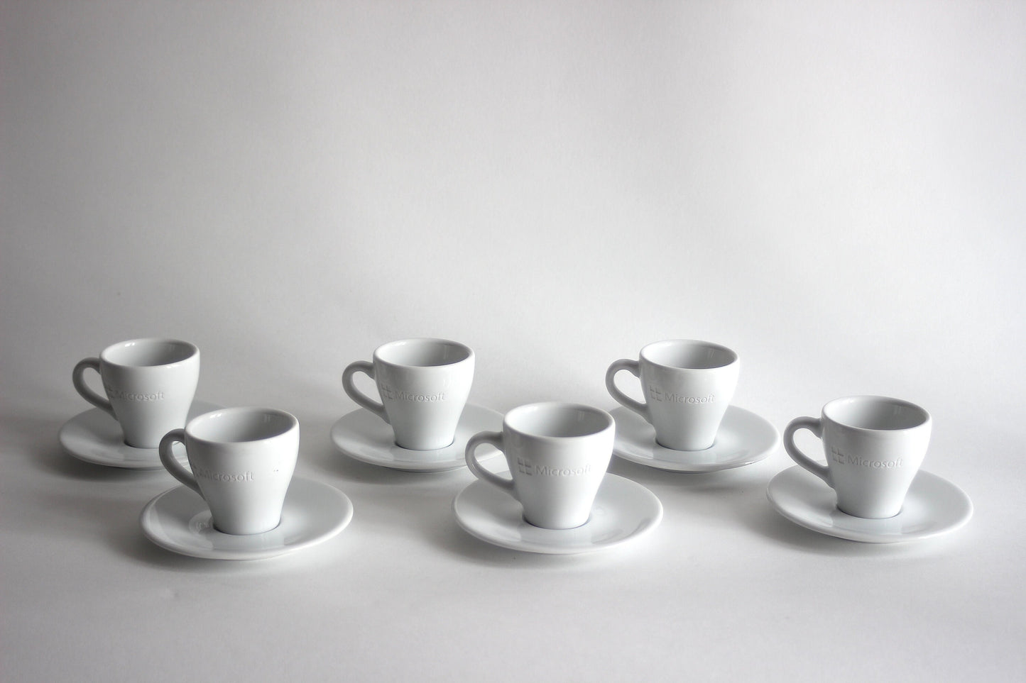 Set of espresso cups with plates MICROSOFT X ARROW ELECTRONICS. 90s.