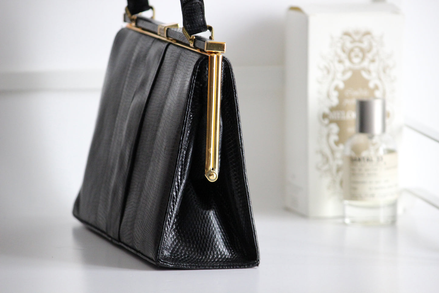 Eleanor – early ’60s black lizard-embossed leather frame bag by Jane Shilton