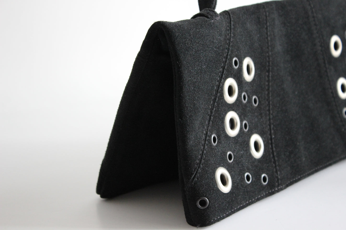 Atos Lombardini – early 2000s black suede clutch with grommet details