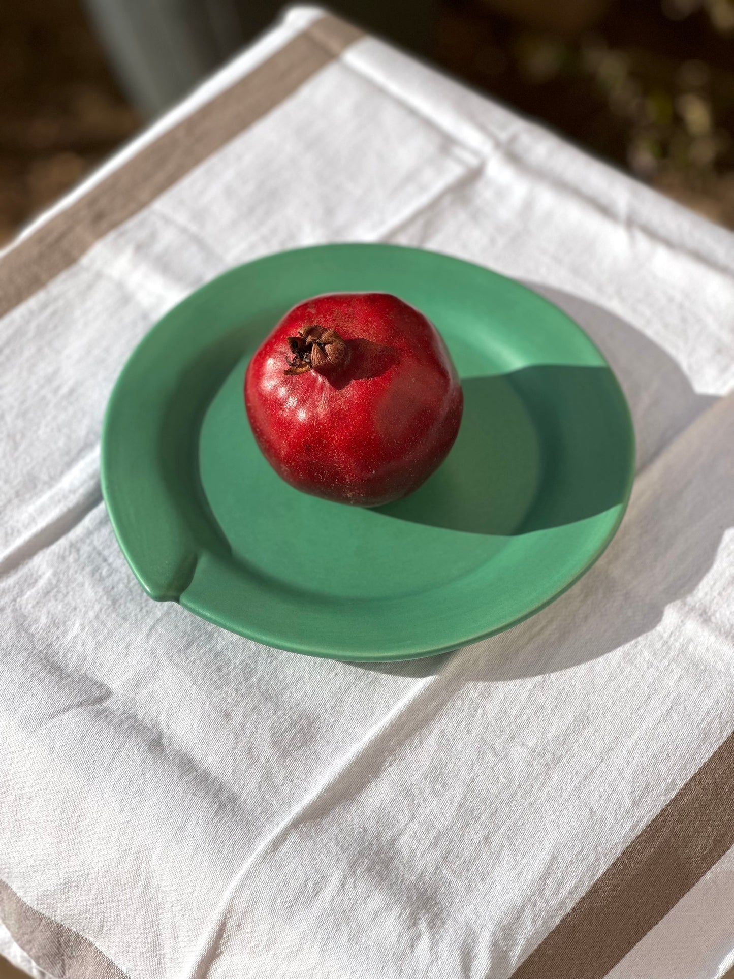 Julie Sanders “Cyclamen” dinnerware set – matte green ceramic, 20-piece, 1990s