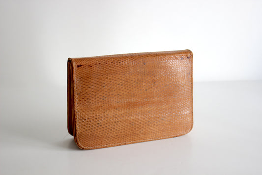 Calliope – mid ’70s honey-tan vegetable-tanned cowhide clutch with raw-leather interior