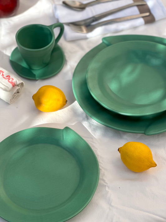 Julie Sanders “Cyclamen” dinnerware set – matte green ceramic, 20-piece, 1990s