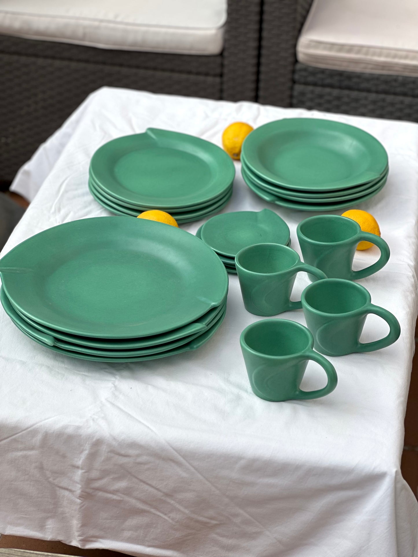 Julie Sanders “Cyclamen” dinnerware set – matte green ceramic, 20-piece, 1990s
