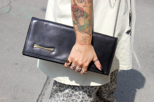 Eris – mid ’80s–early ’90s black calf-leather envelope clutch with gold-tone snake-chain strap