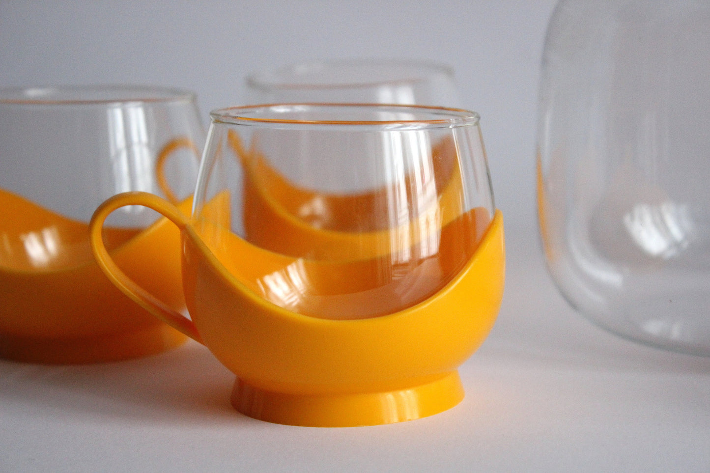 Melitta Germany Set of yellow glass tumblers and pitcher with plastic handles - 60s / 70s