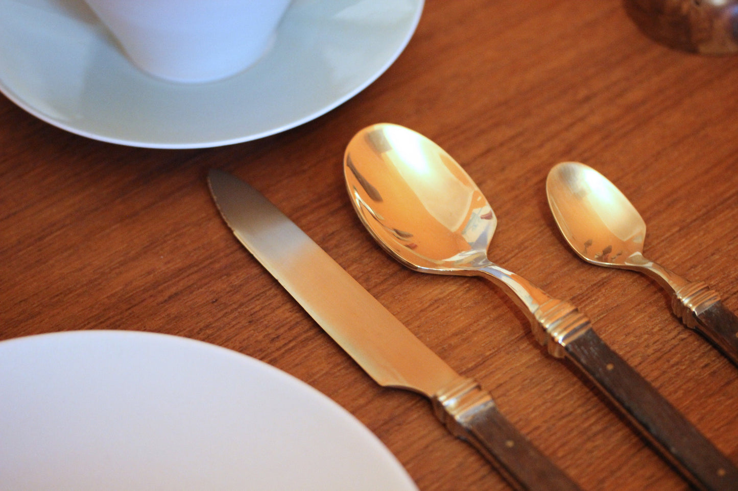 Vintage Scandinavian teak wood brass cutlery set of 48 pieces from the late 60's. Mid-Century teak wood cutlery.