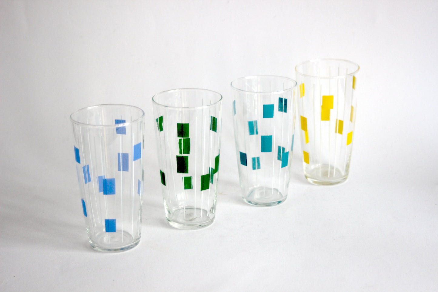 Vintage set of 4 hand-painted blown glass colorful drinking glasses, water glasses or tumbler glasses. Mid-century Austria 1950s.