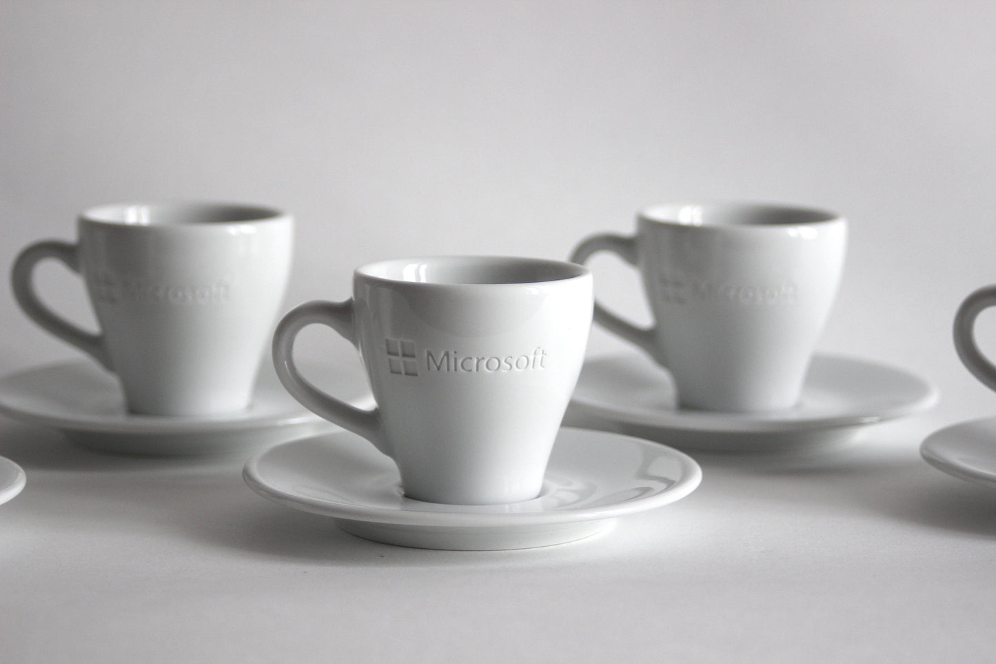Set of espresso cups with plates MICROSOFT X ARROW ELECTRONICS. 90s.