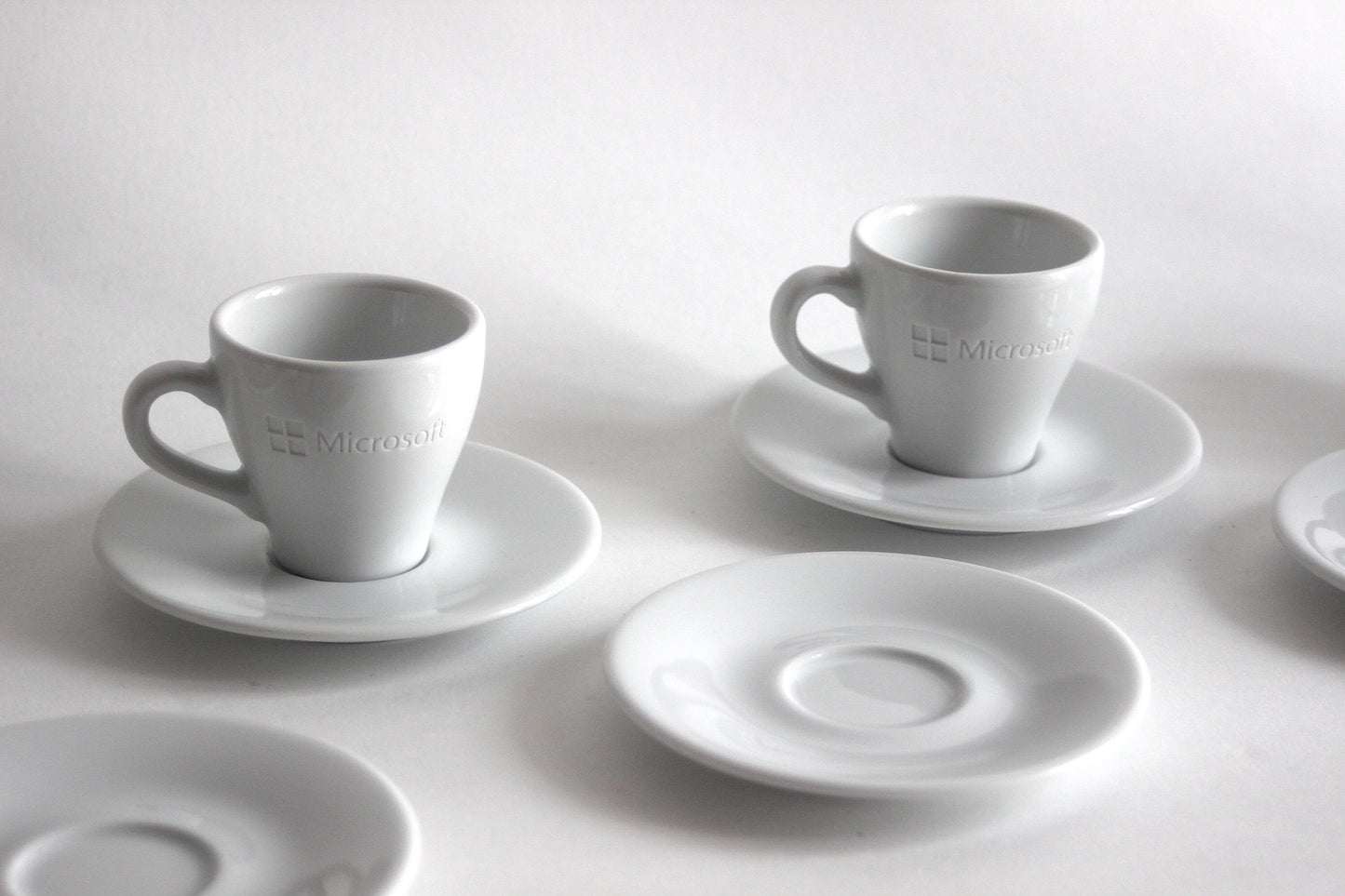 Set of espresso cups with plates MICROSOFT X ARROW ELECTRONICS. 90s.