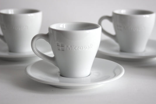 Set of espresso cups with plates MICROSOFT X ARROW ELECTRONICS. 90s.