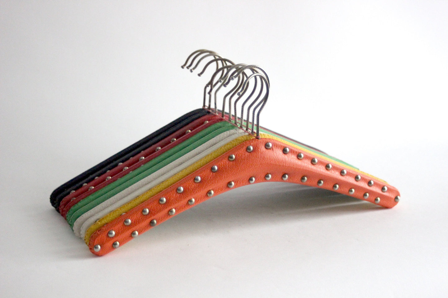 Set of 10 vintage skai hangers with silver studs. Mid-century. Germany, 1960s